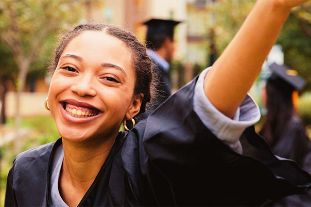 Girl smiling on her graduation day.