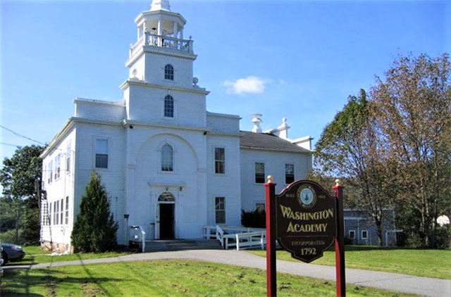 Washington Academy building with name sign in front.